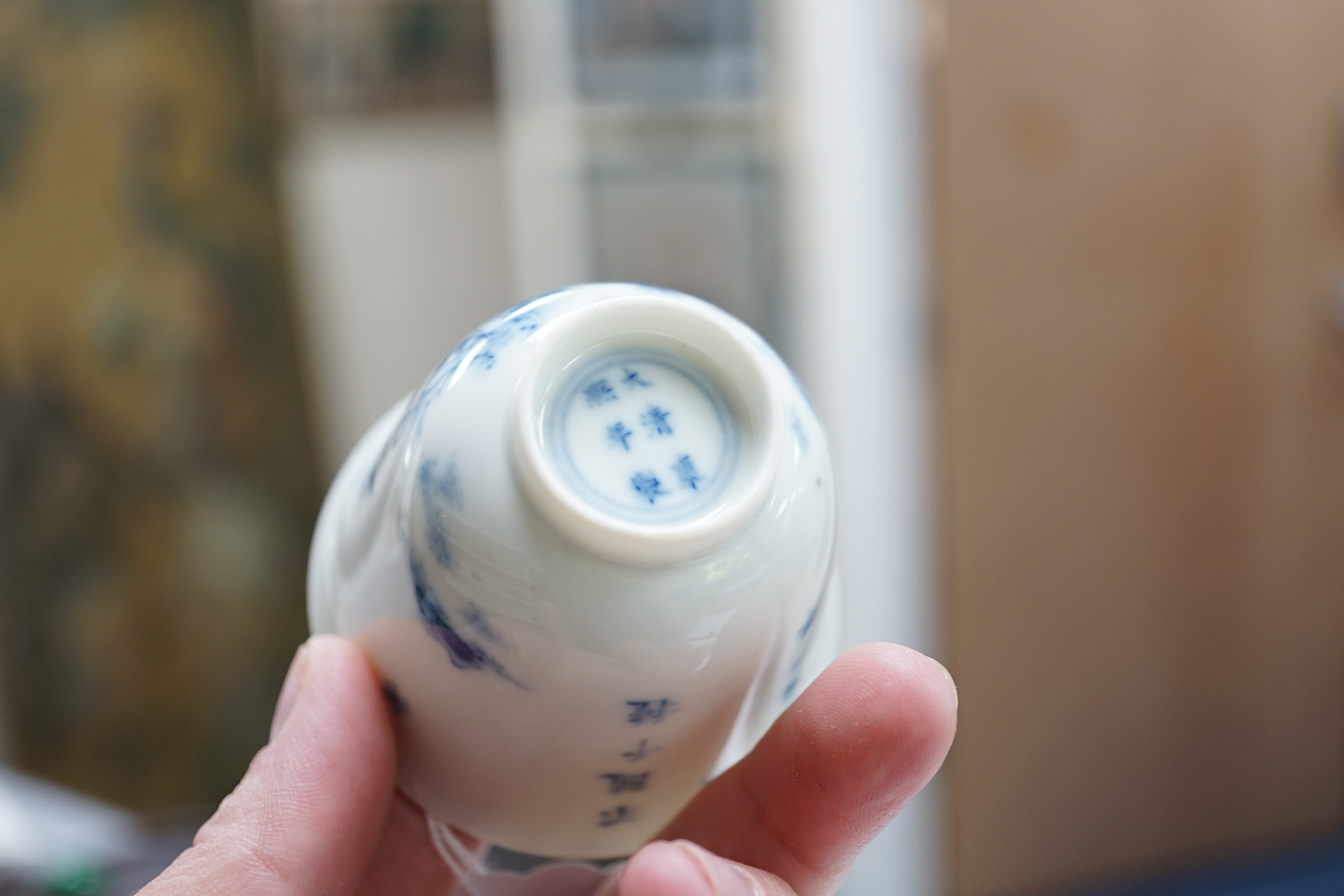 A Chinese blue and white 'month' cup, Kangxi mark, probably late 19th century